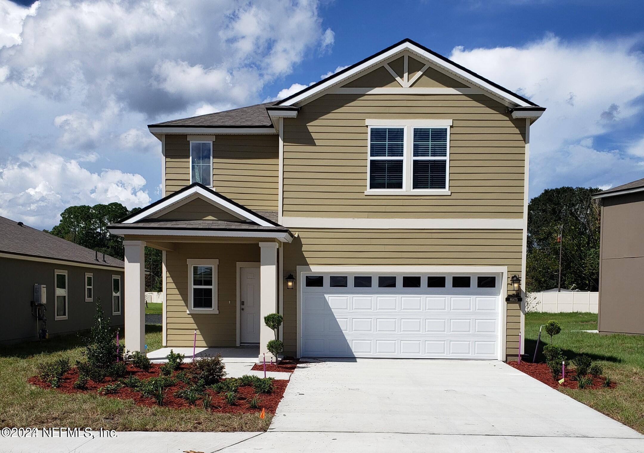 a front view of a house with yard