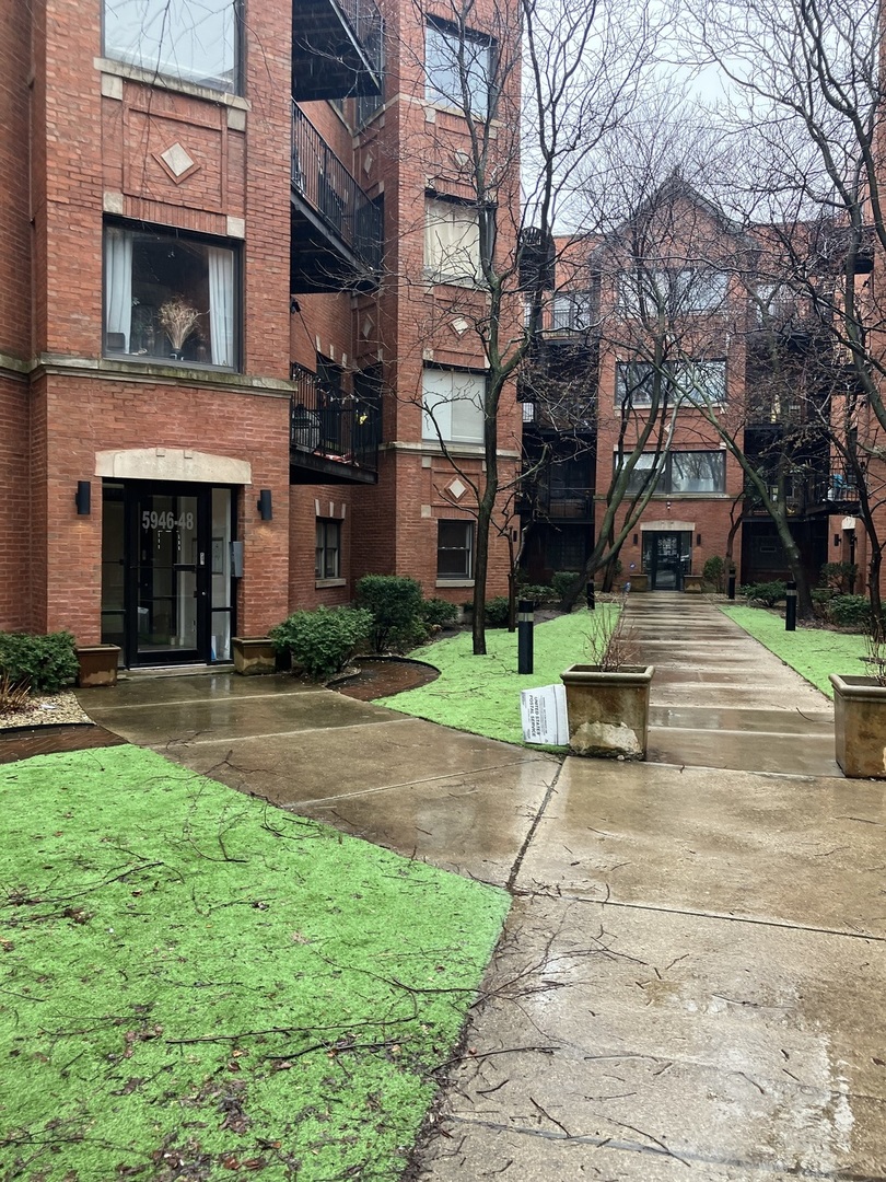 a view of a building with a yard