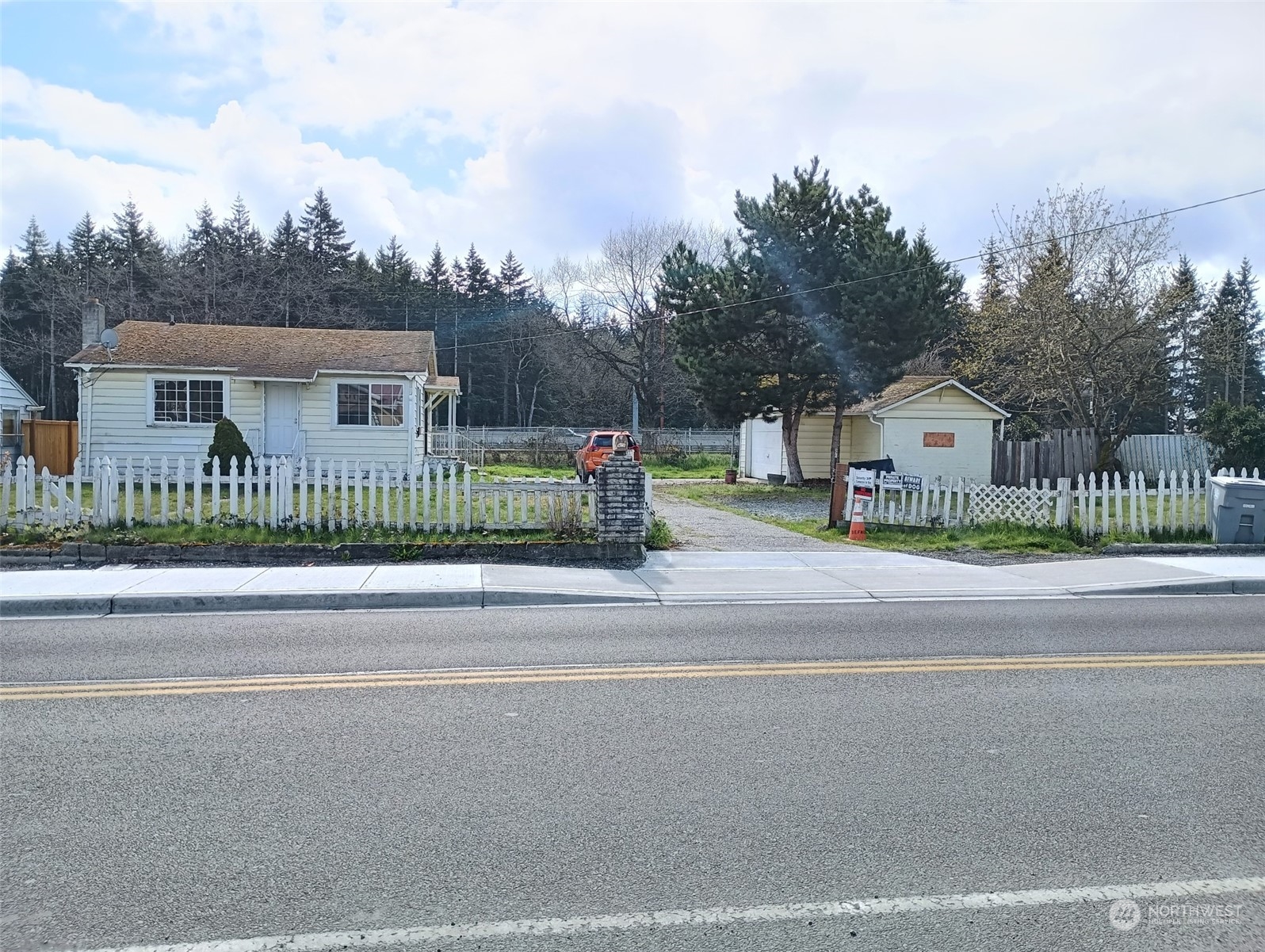 front view of a house with a street