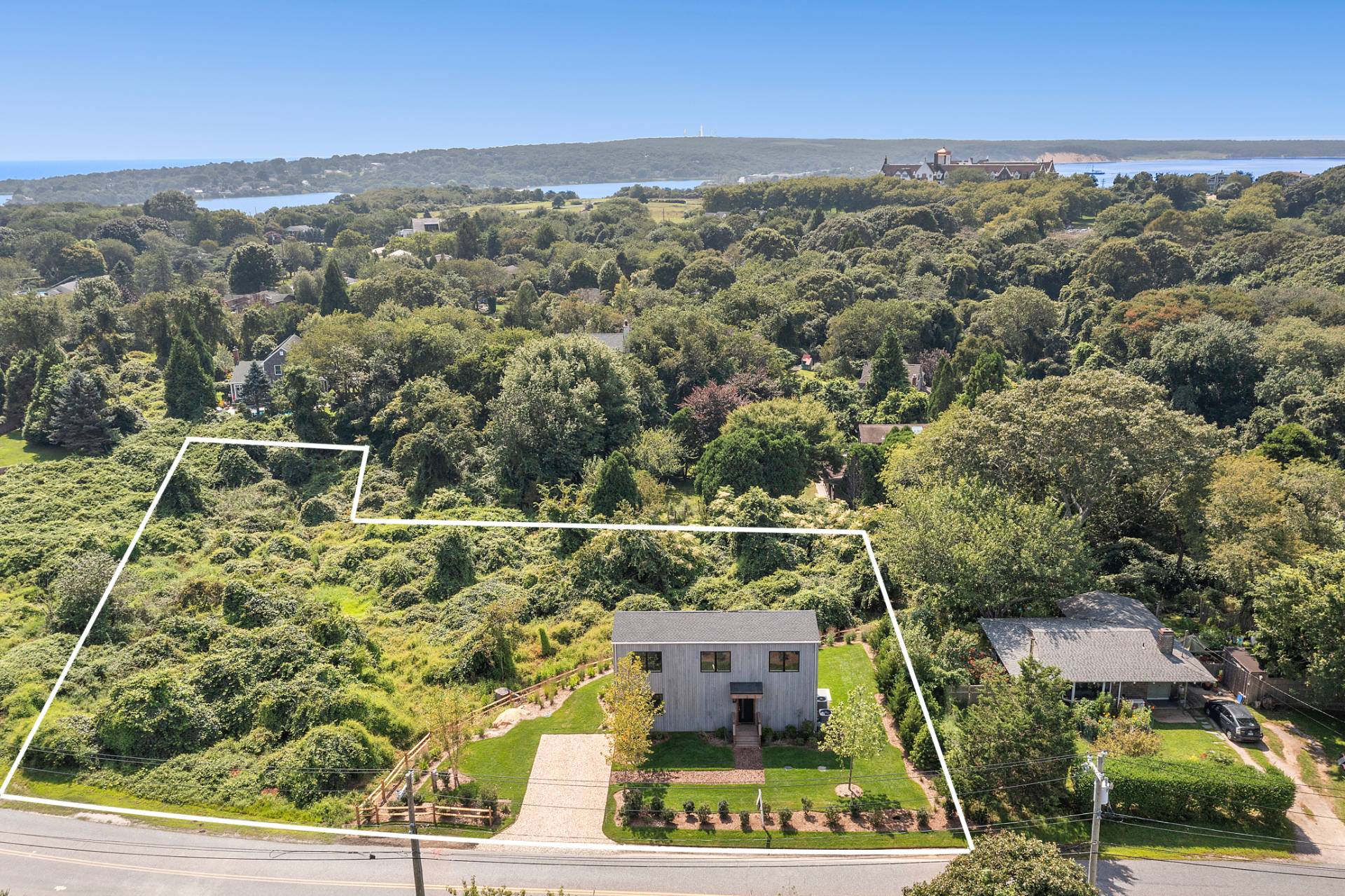 an aerial view of a house with a yard