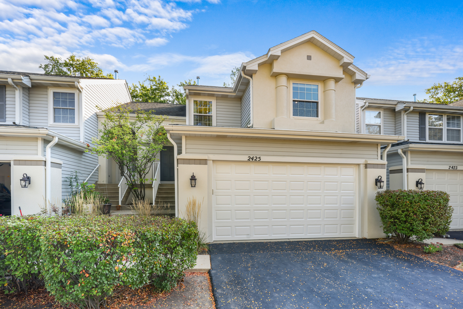 a front view of a house with a yard