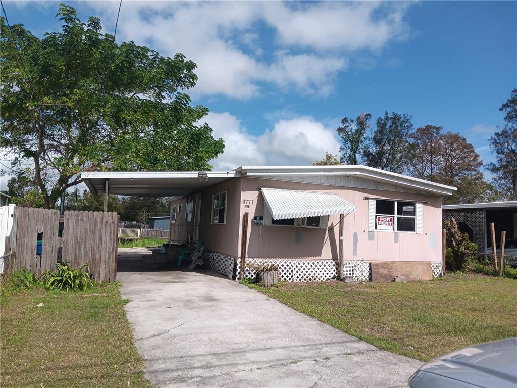 a view of house and outdoor space with yard