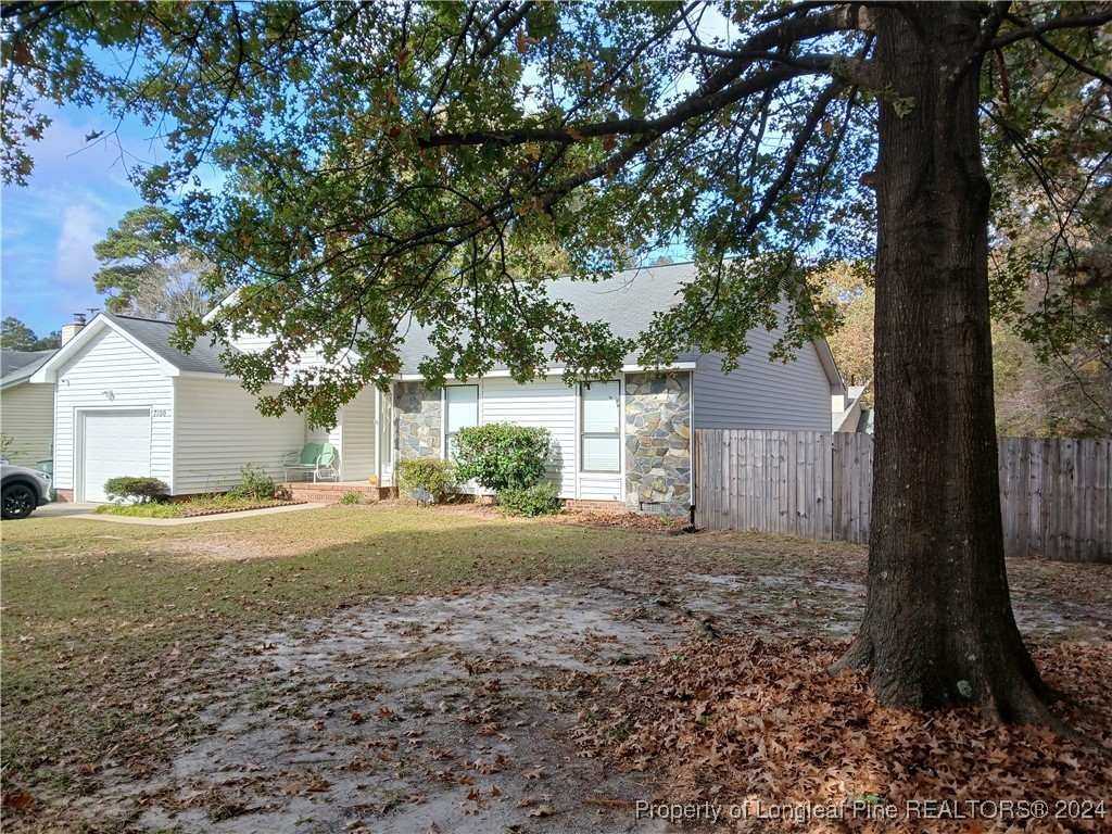 a big house with trees in the background