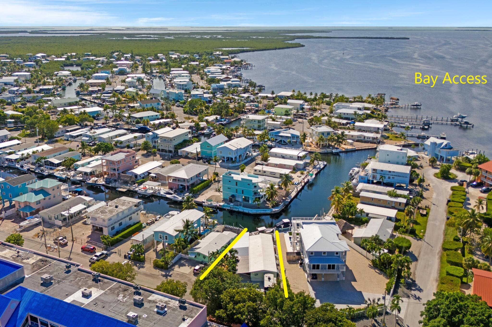 an aerial view of residential building and ocean