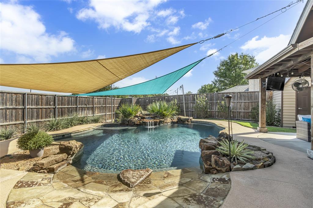 a view of a swimming pool with a patio