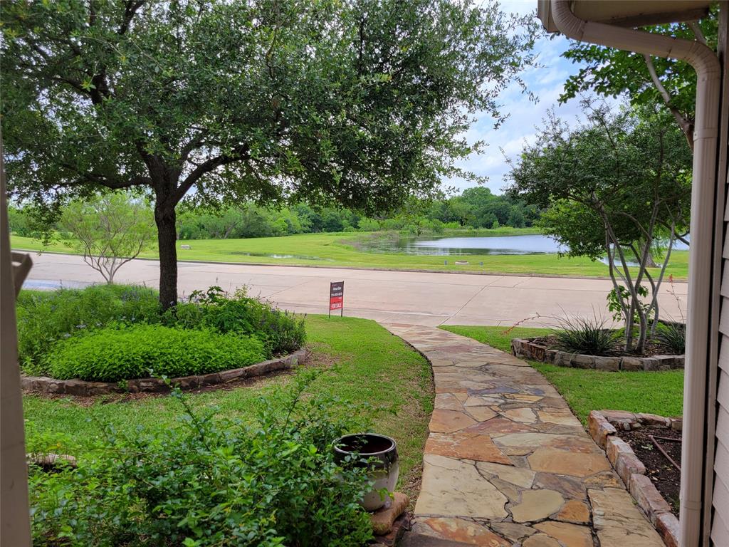 a view of a swimming pool with a yard