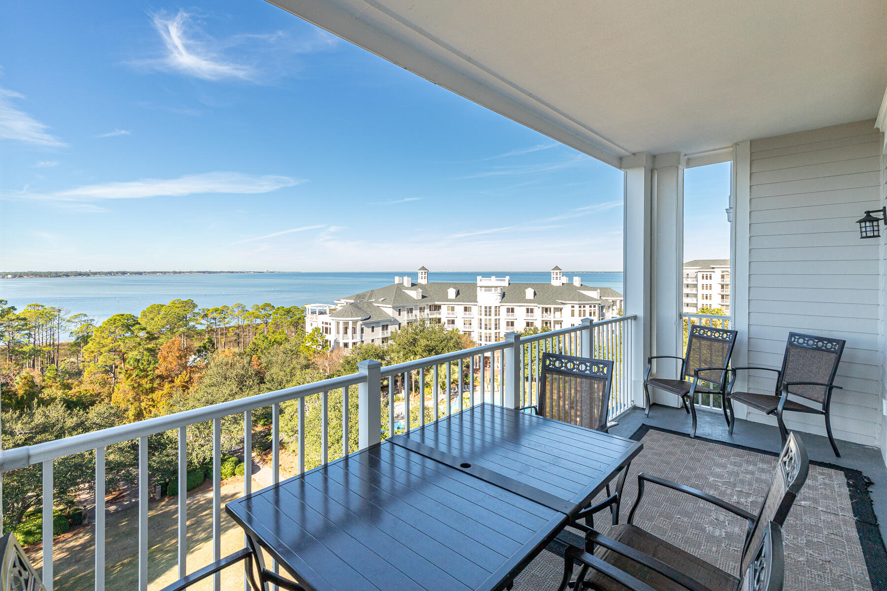 a view of a balcony with furniture