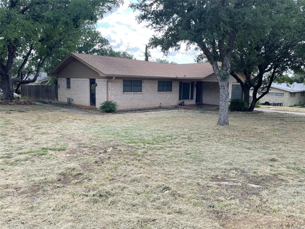 a house with a tree in front of it