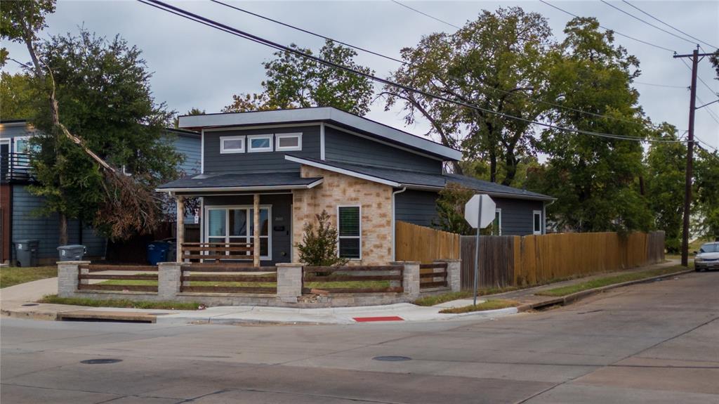 a front view of a house with a street