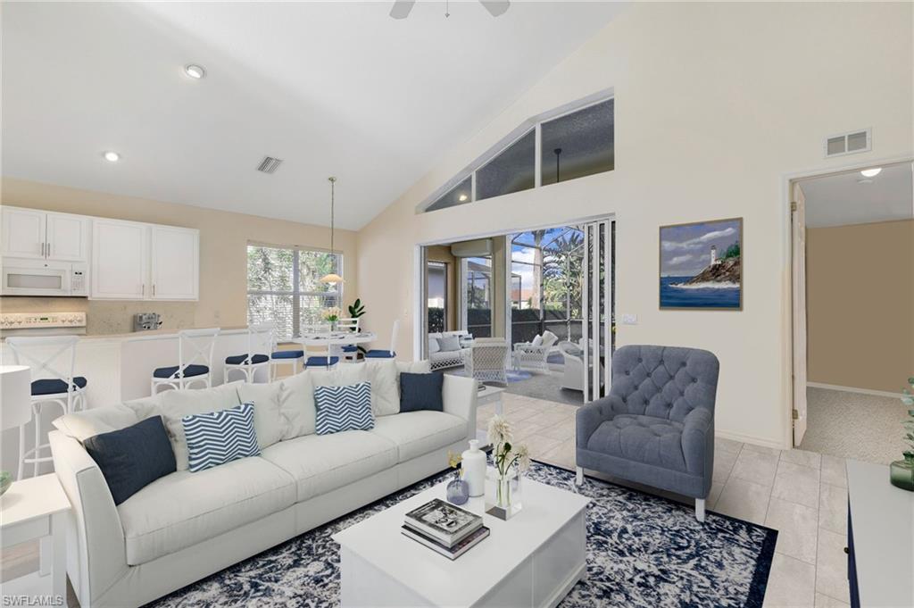 a living room with furniture and a rug