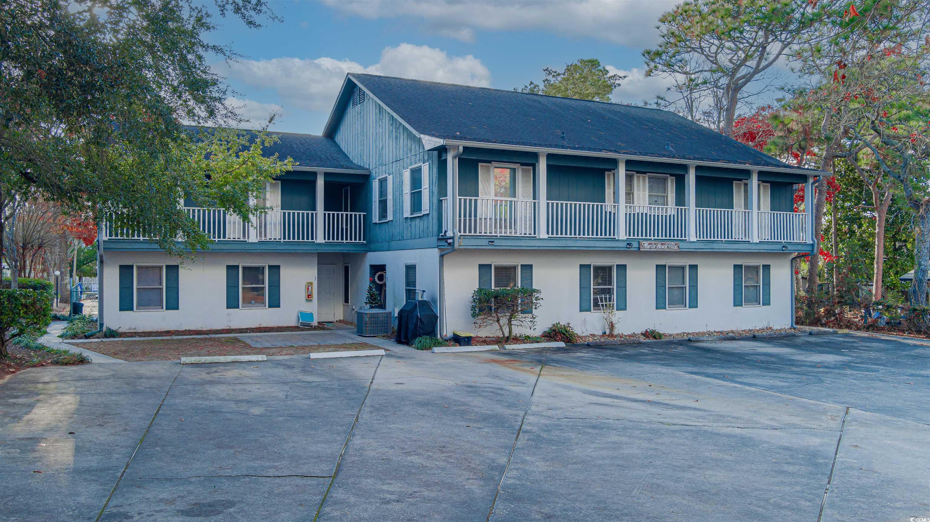 View of front of home featuring a balcony