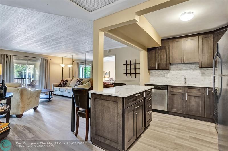 a kitchen with a stove top oven sink and cabinets