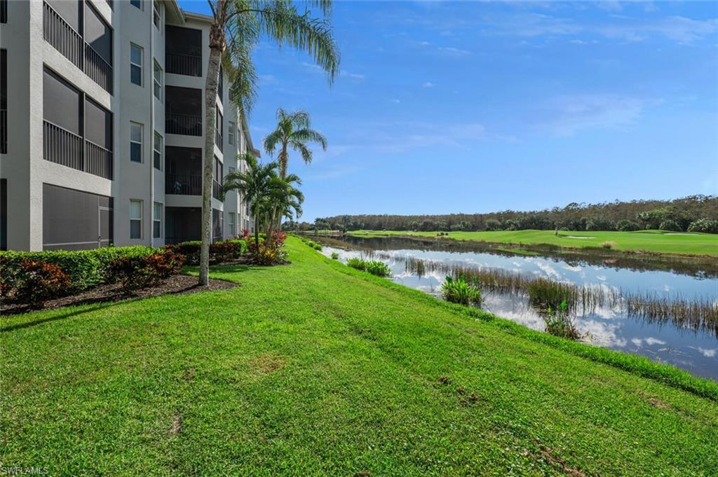 a view of a lake with a building in the background