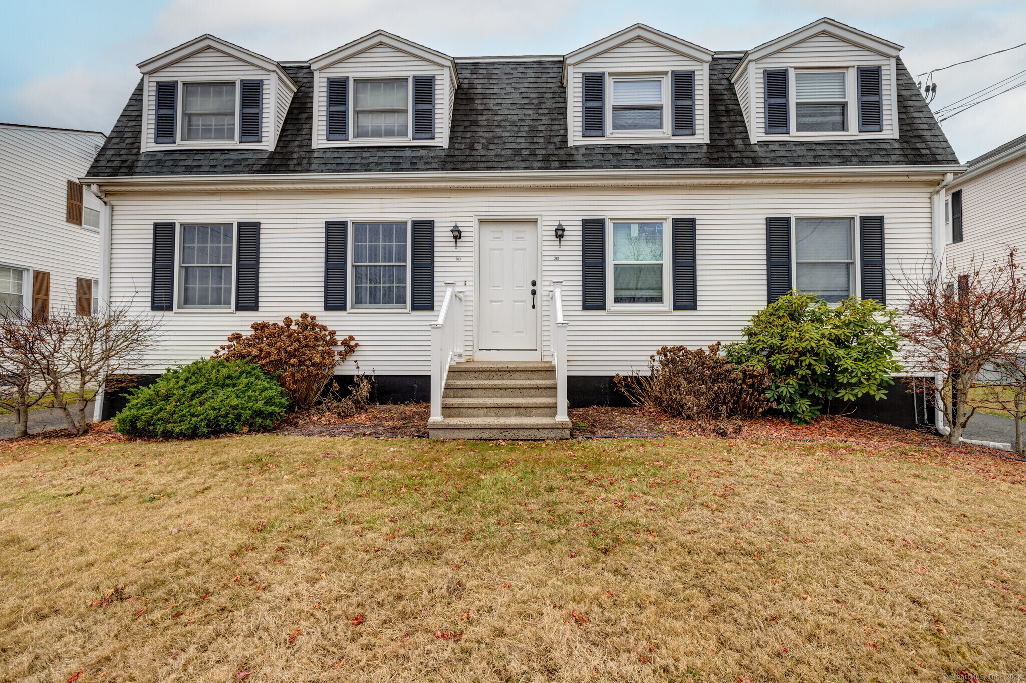 front view of a house with a small yard