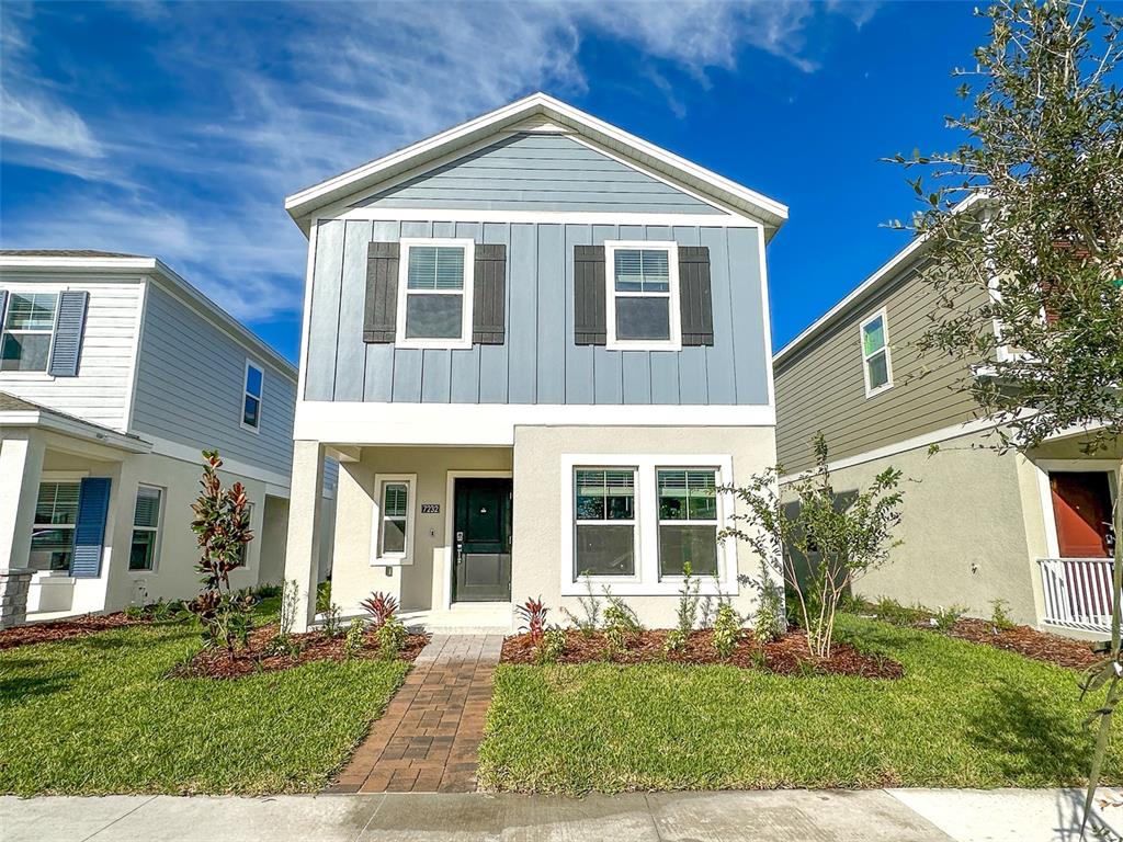 a front view of a house with a yard