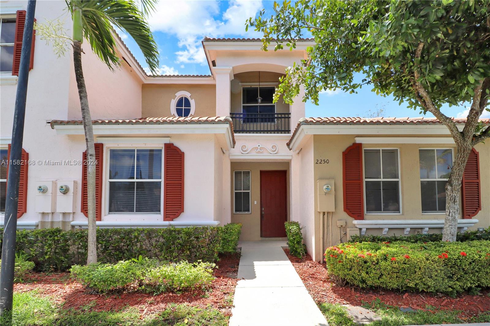 front view of a house with a yard