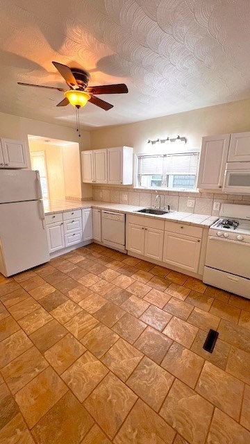 a kitchen with stainless steel appliances a sink and a stove