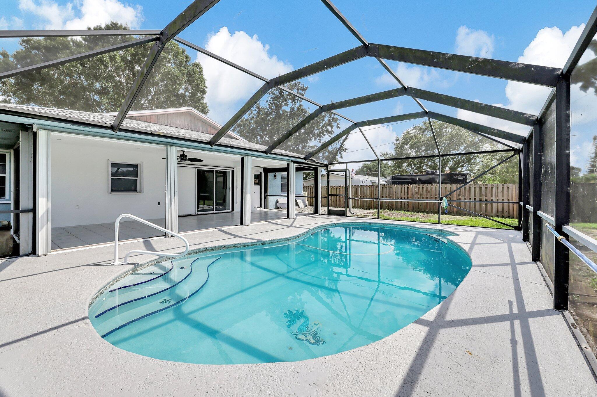 a view of a swimming pool with a patio