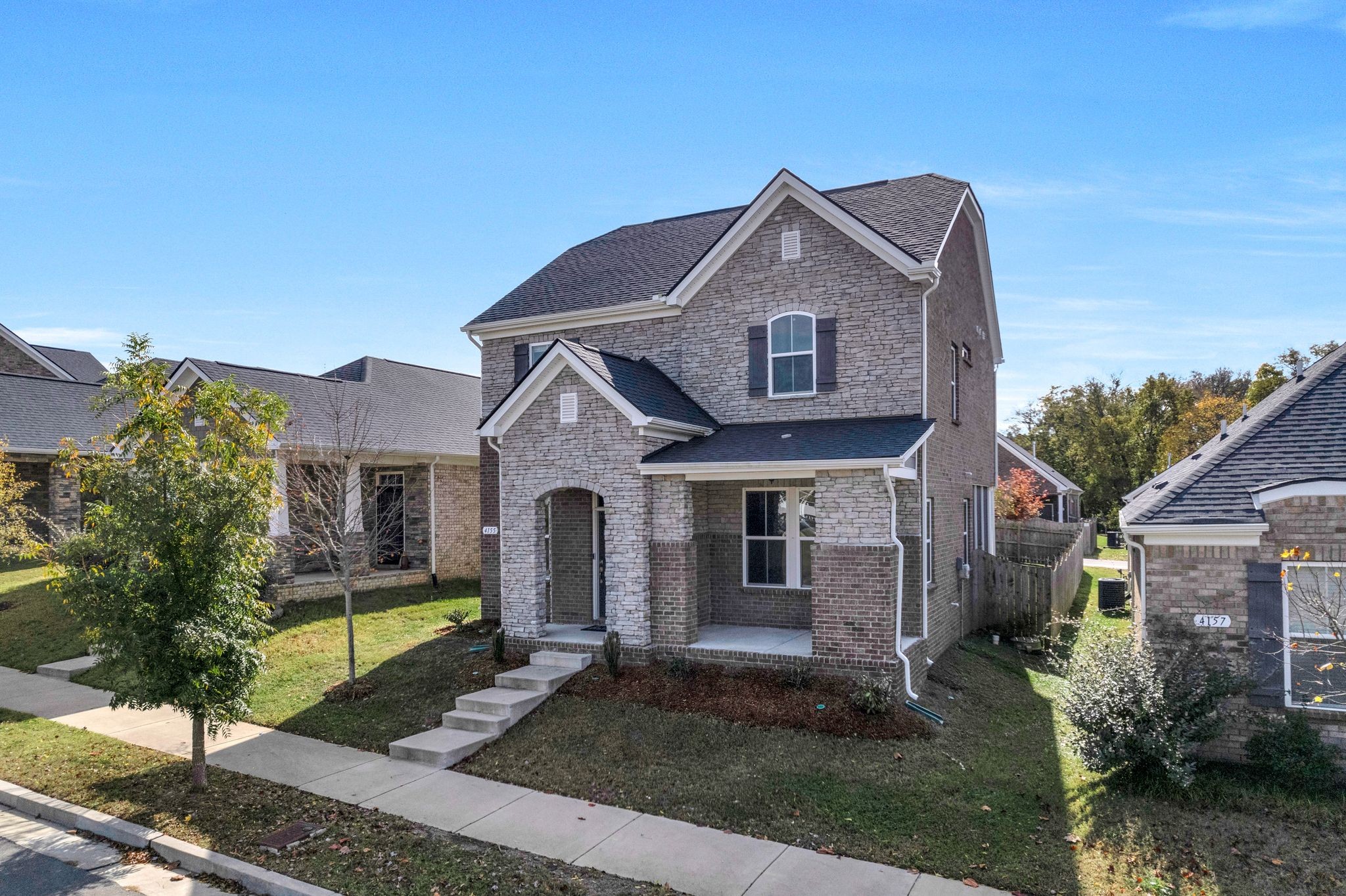 a front view of a house with a yard