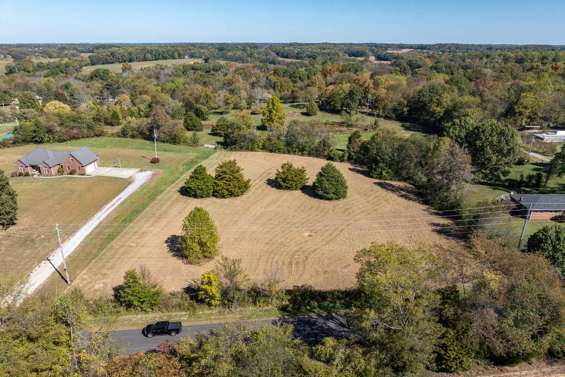 a view of a lake with a yard