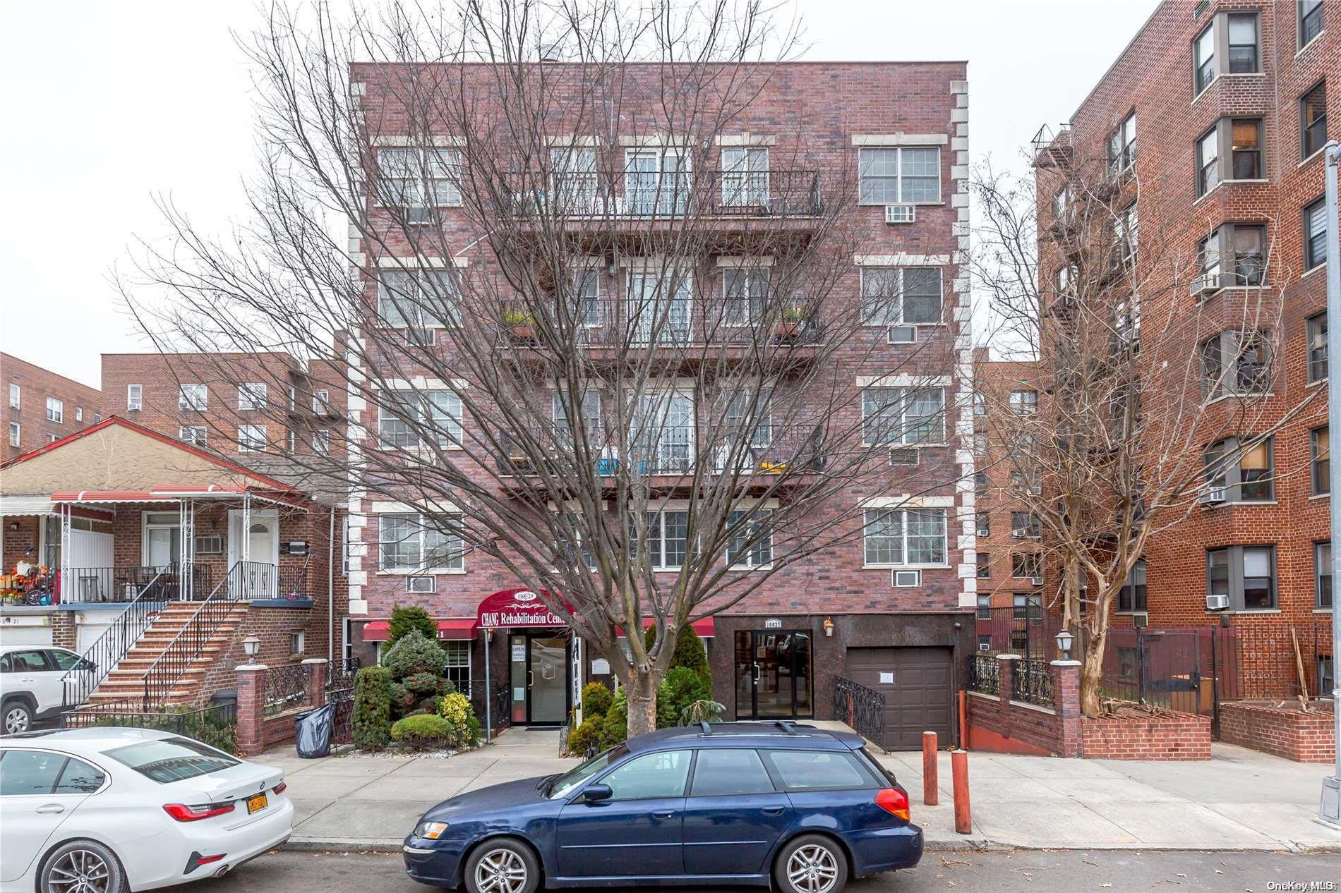 a car parked in front of a brick building