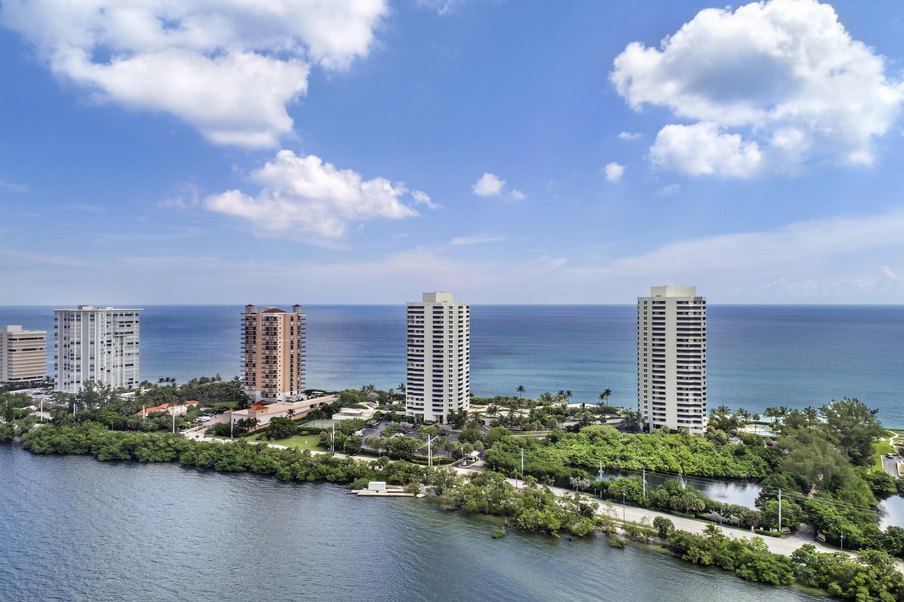 a view of a city with tall buildings and a lake view