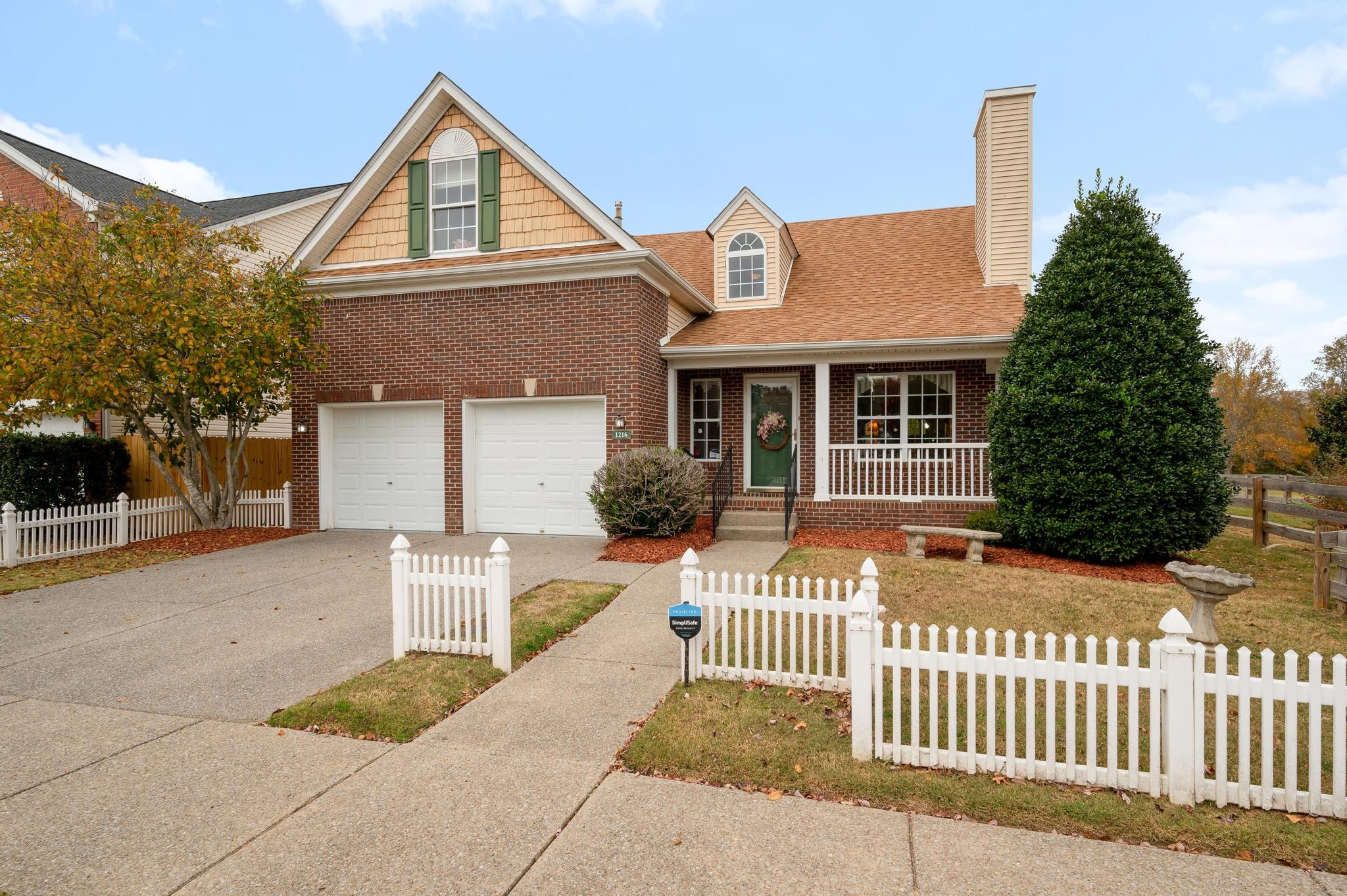 a front view of a house with a porch