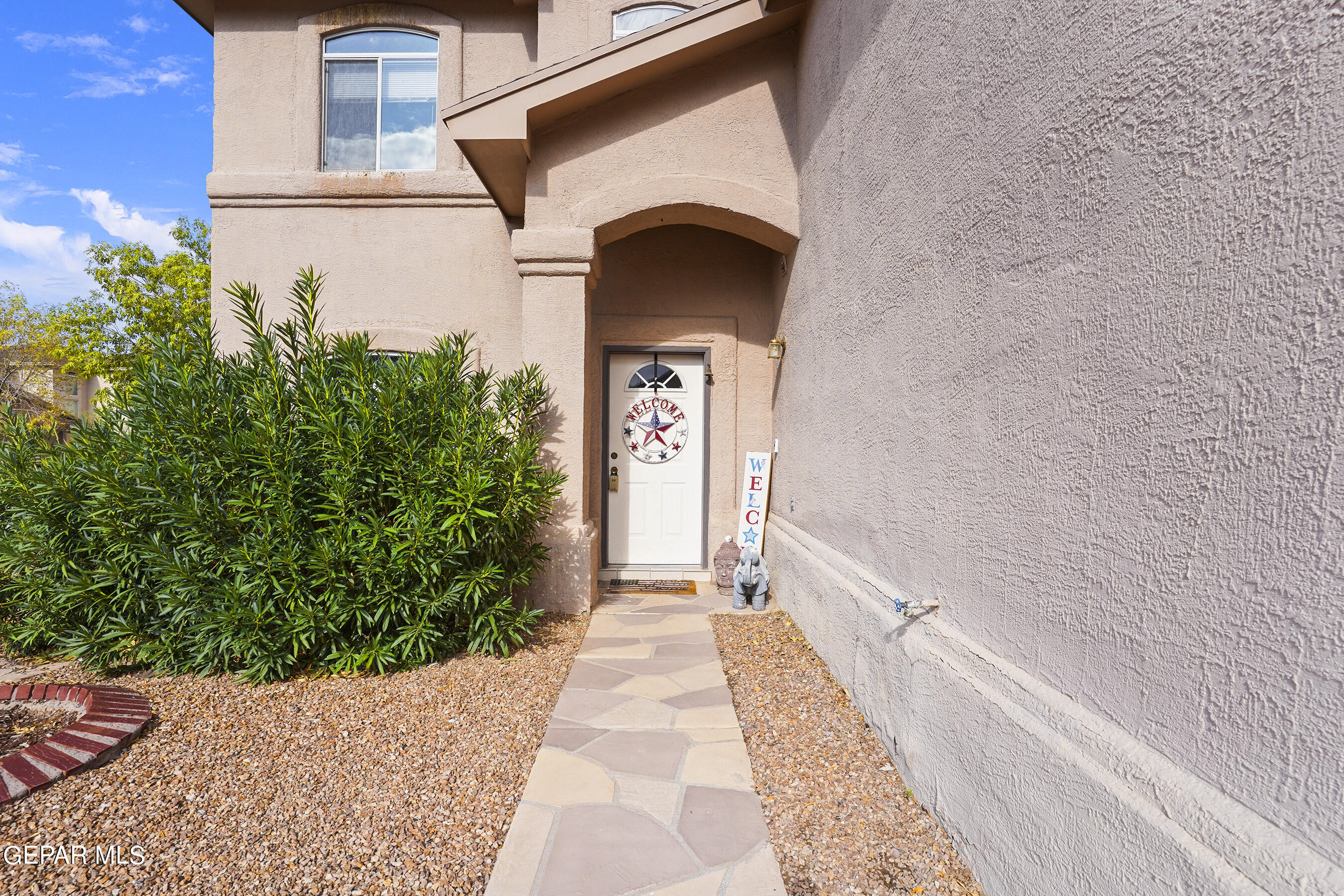 a front view of a house with a outdoor space