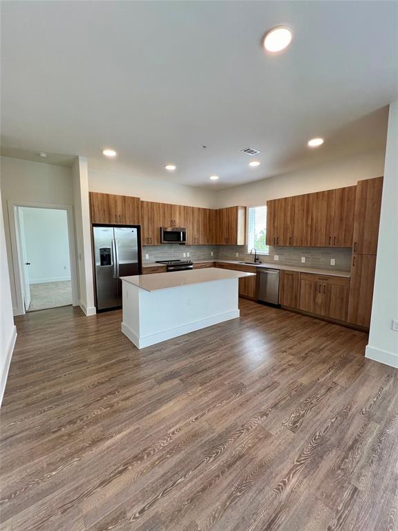 a view of kitchen with wooden floor