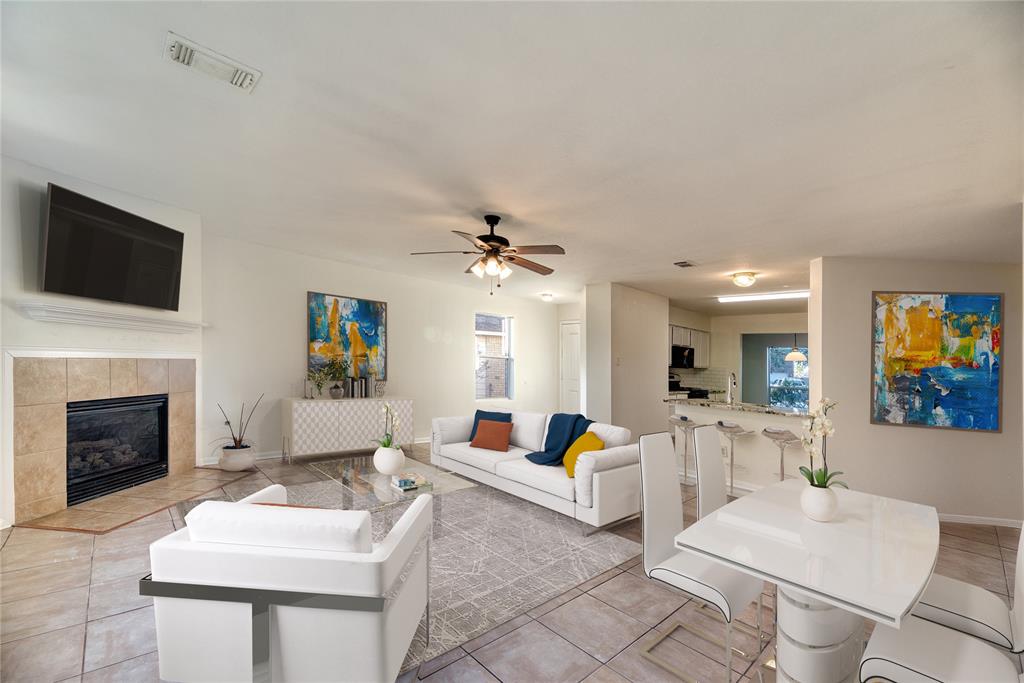 a living room with furniture fireplace and a flat screen tv