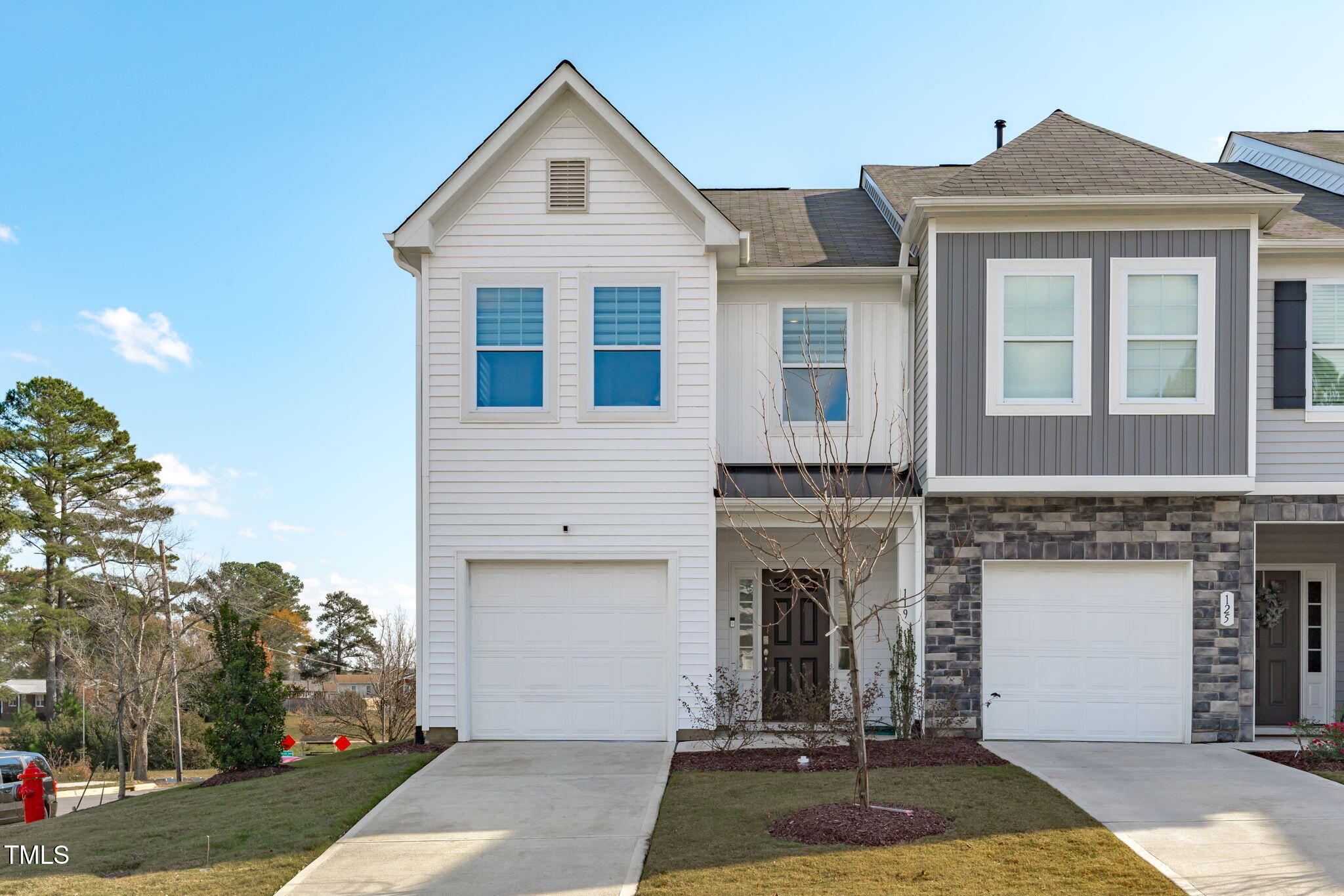 a front view of a house with yard