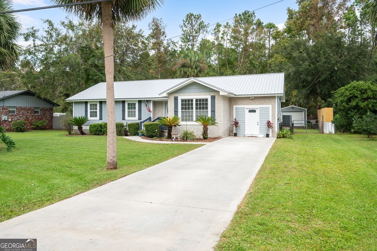 front view of a house with a yard