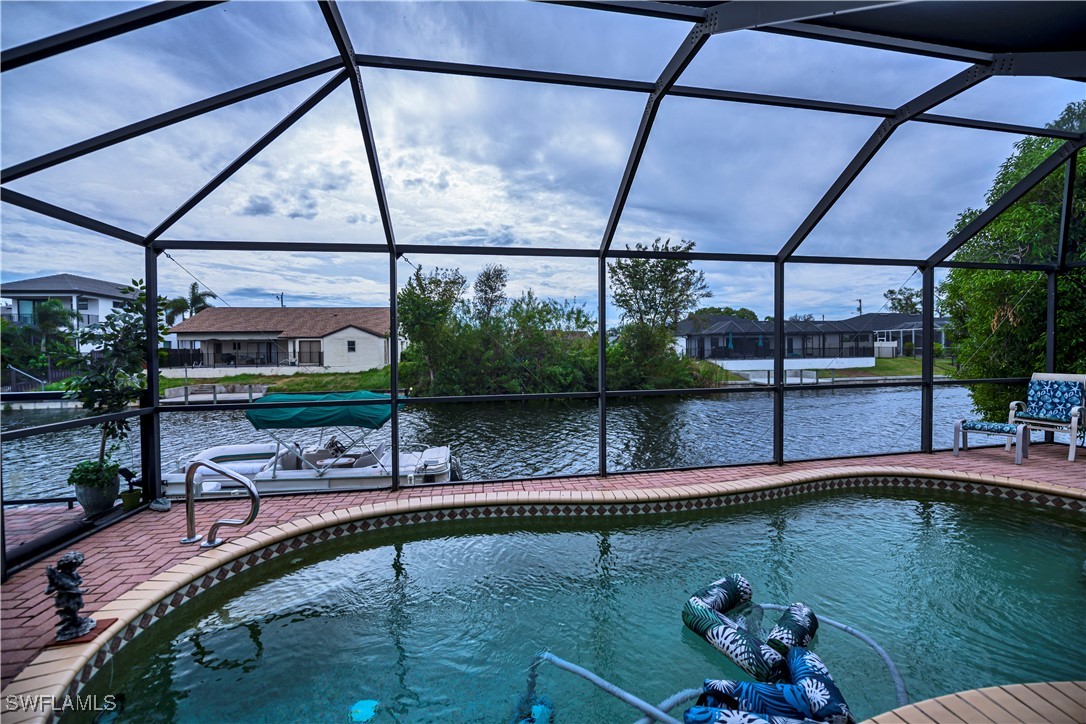 a view of a swimming pool with a patio