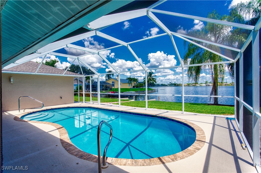 a view of a backyard with swimming pool