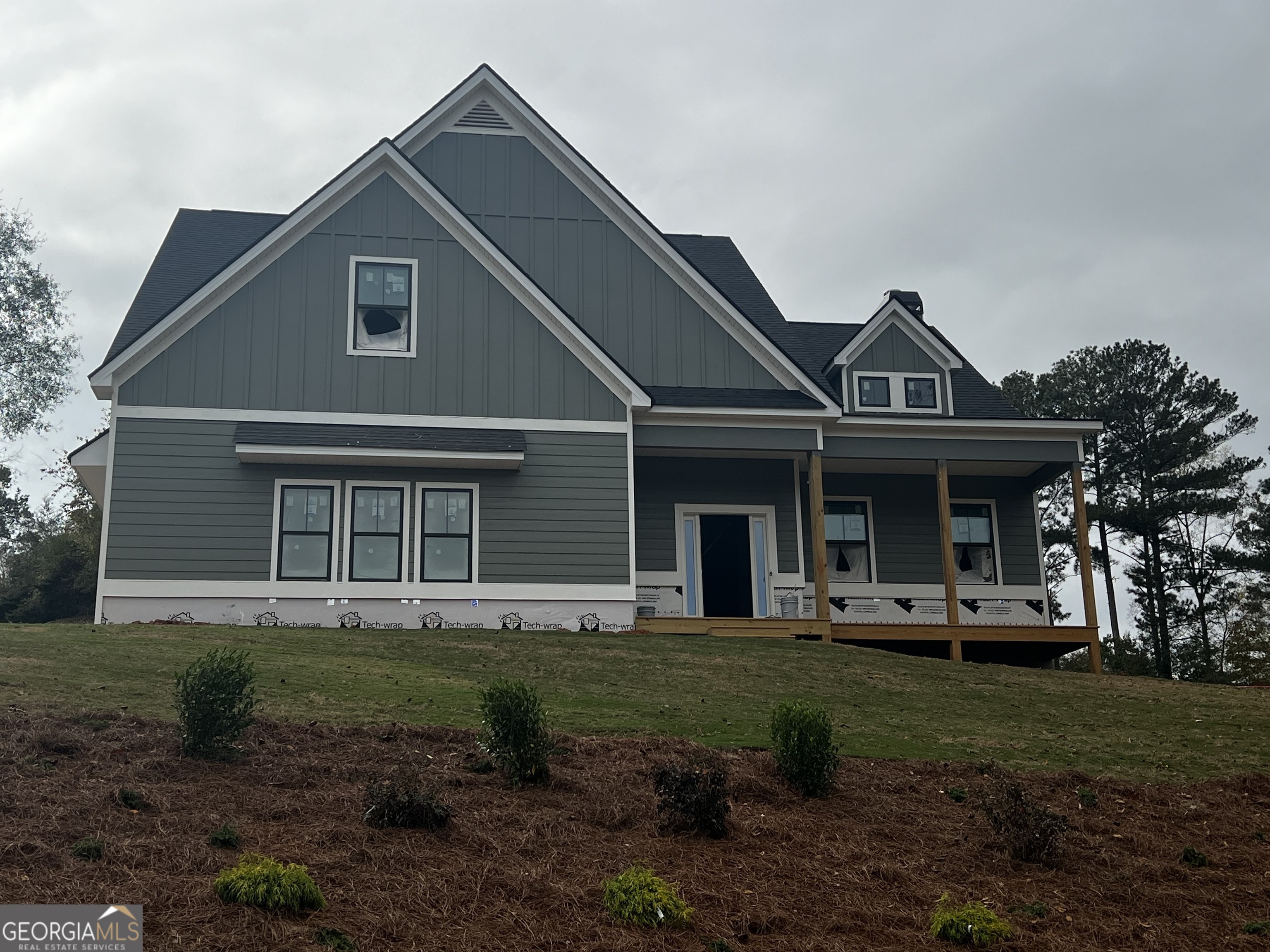 a front view of a house with a yard