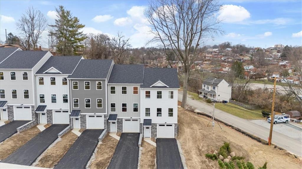 a view of multiple houses with a yard