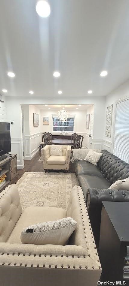 a large white kitchen with a large window