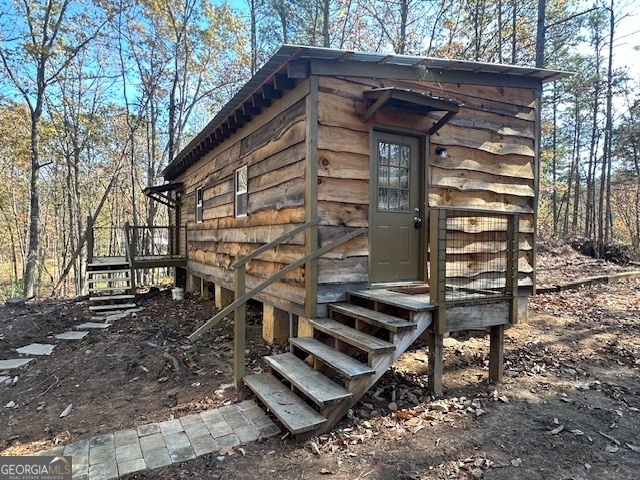 a view of a backyard with chairs