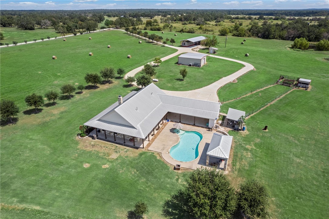 an aerial view of a house with a garden