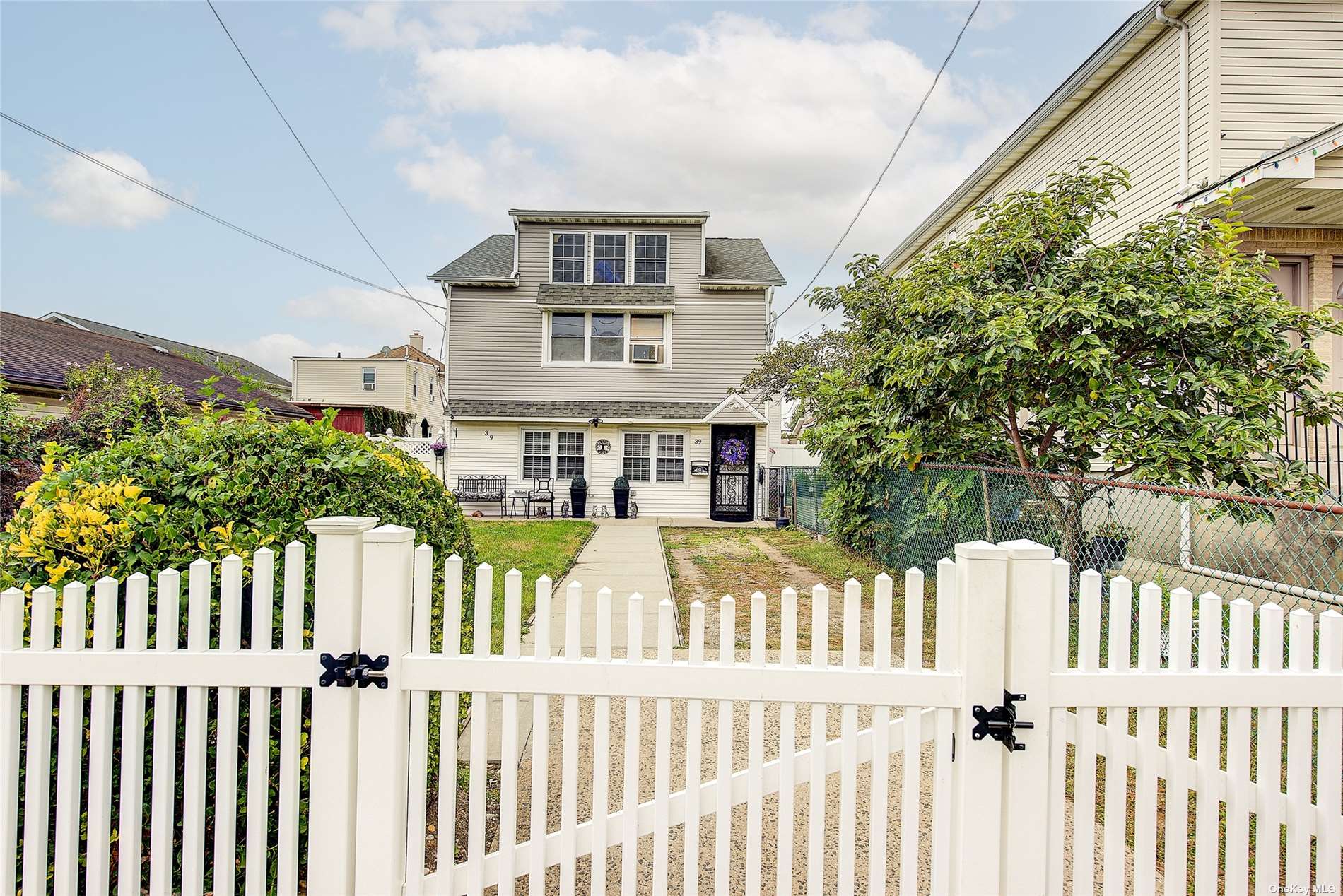 a front view of a house with a fence