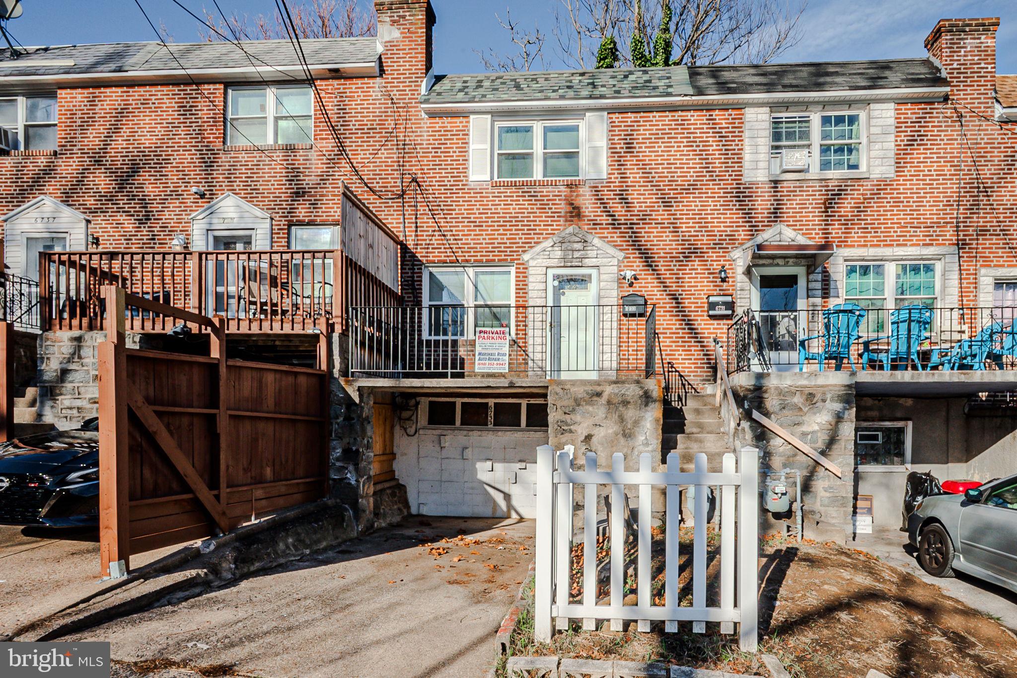 a view of a house with wooden deck