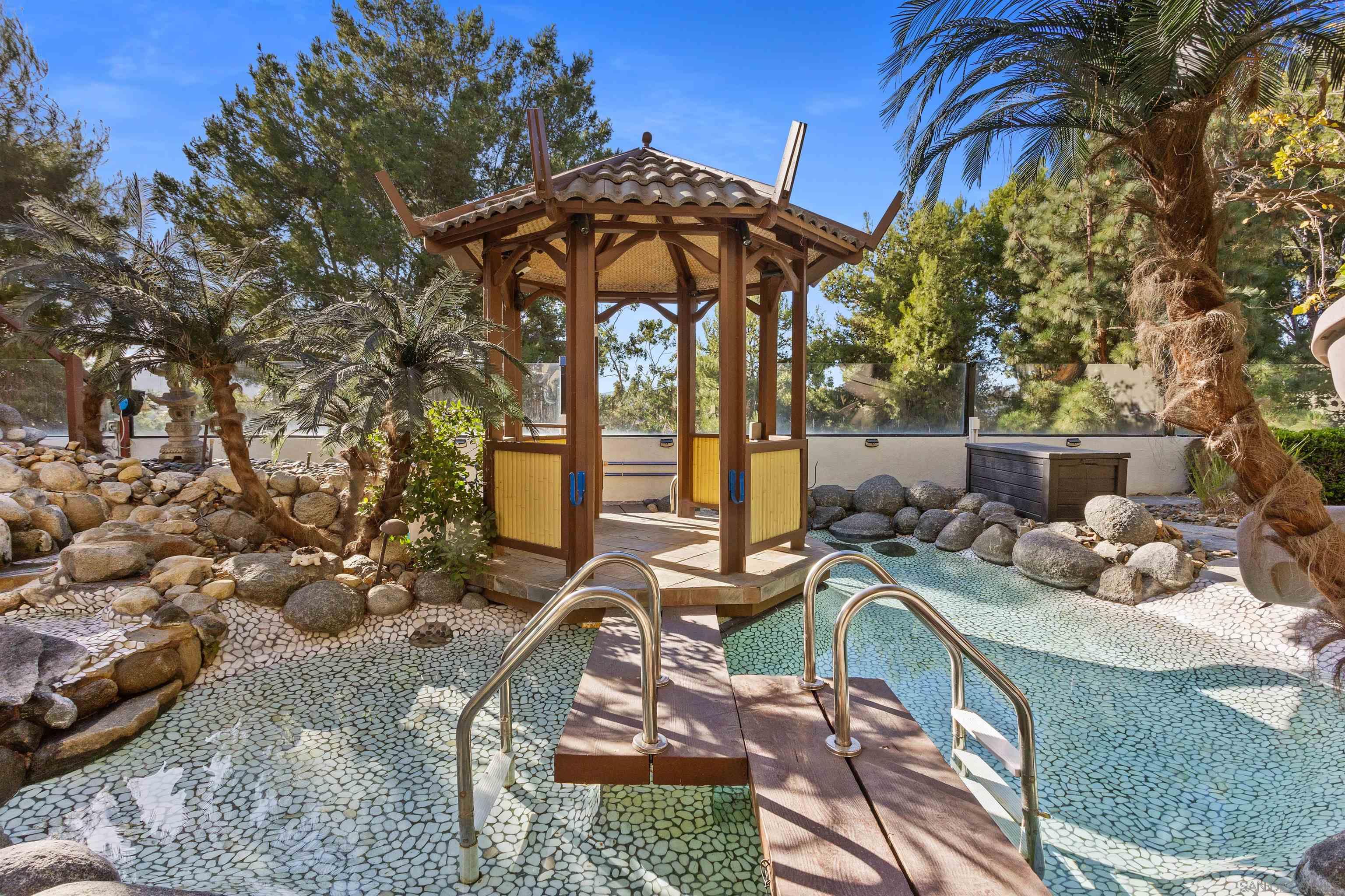 a view of a chairs and table in the patio