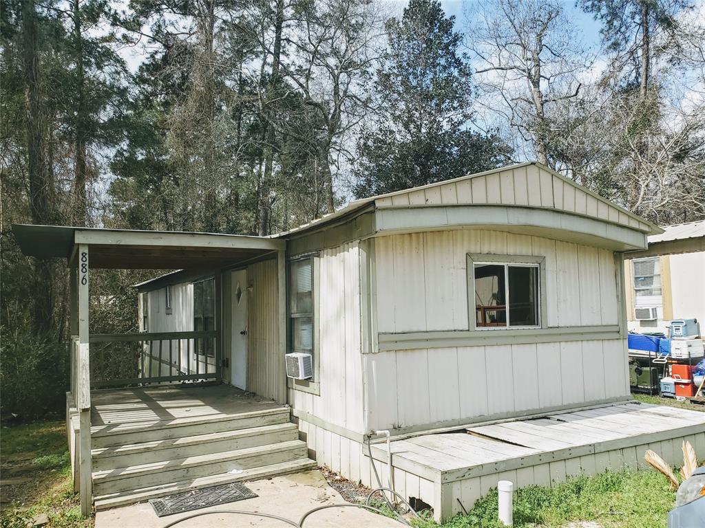 a house with trees in the background