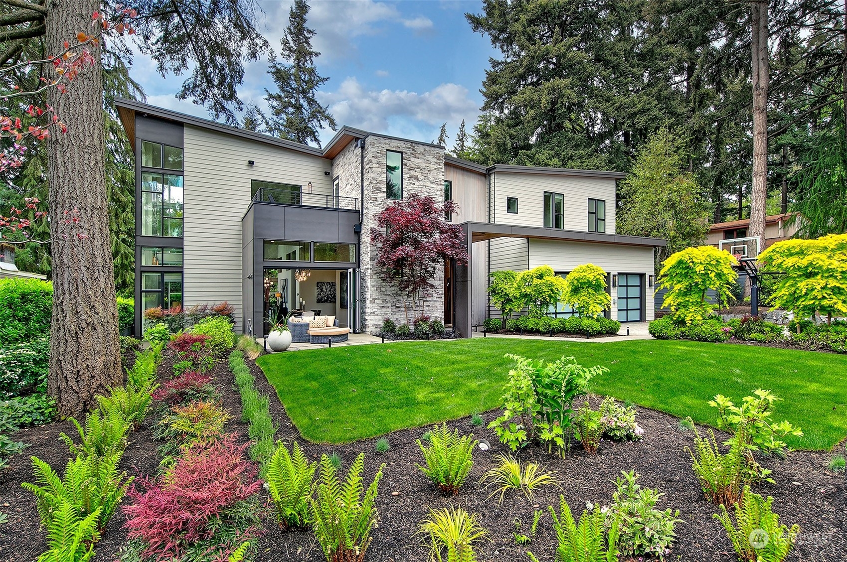 a front view of a house with garden