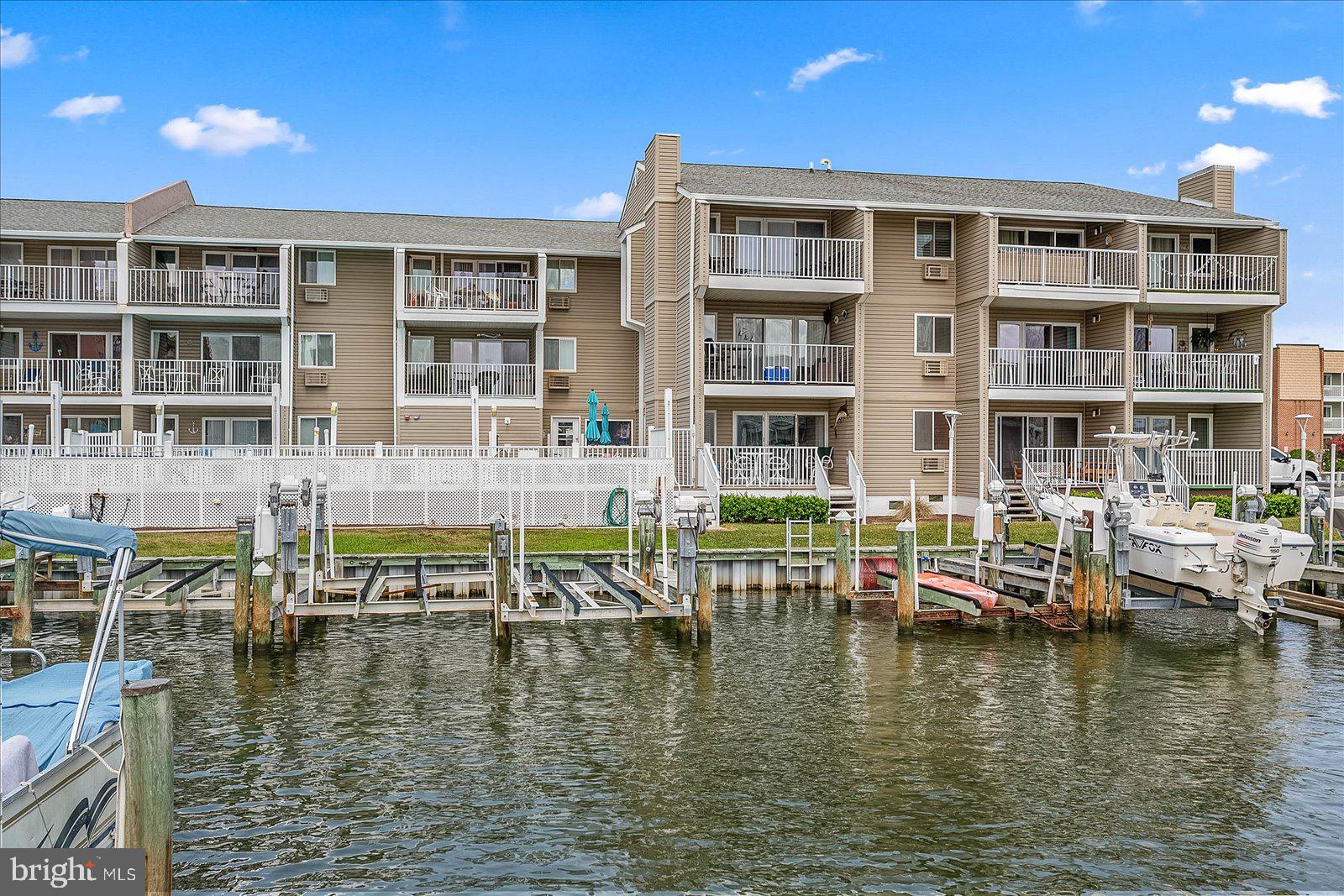 a front view of a building with lake view and lake view