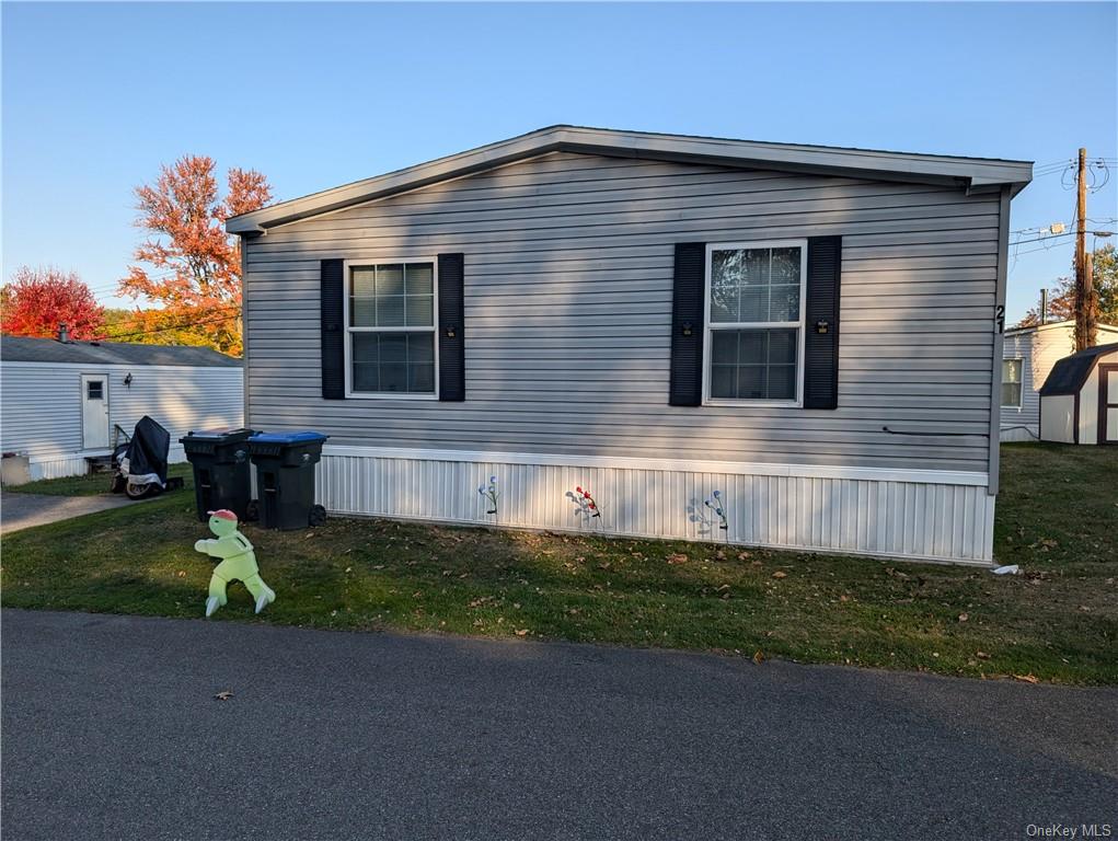 a front view of a house with a yard and porch