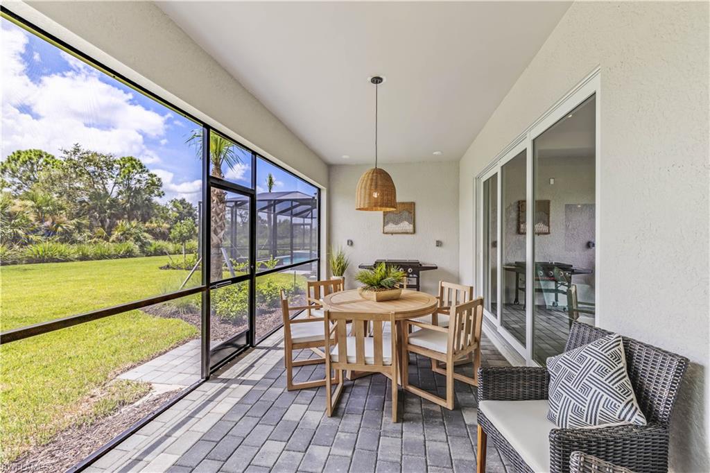 a view of a dining room with furniture window and outside view