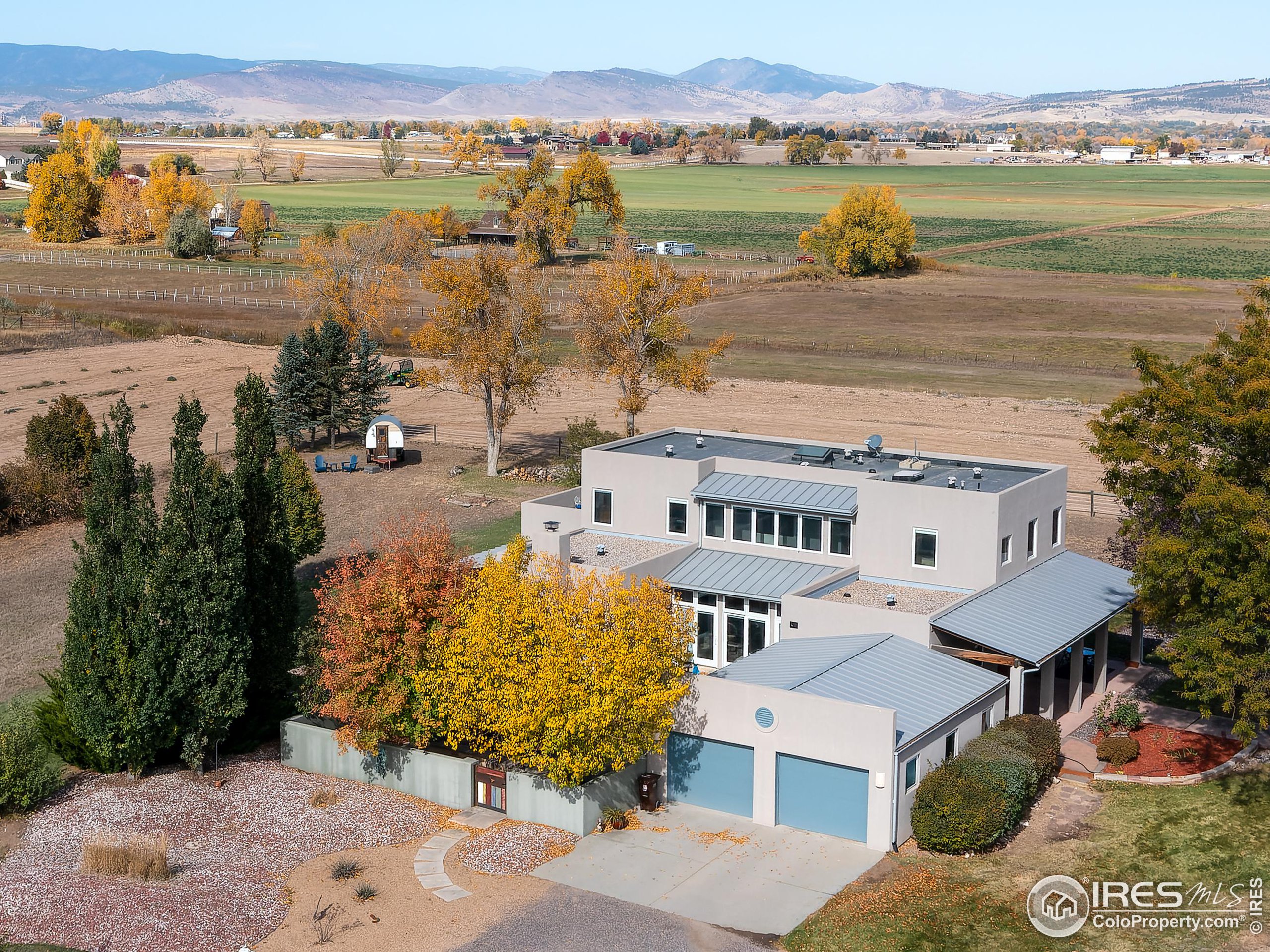 an aerial view of a house with a lake view