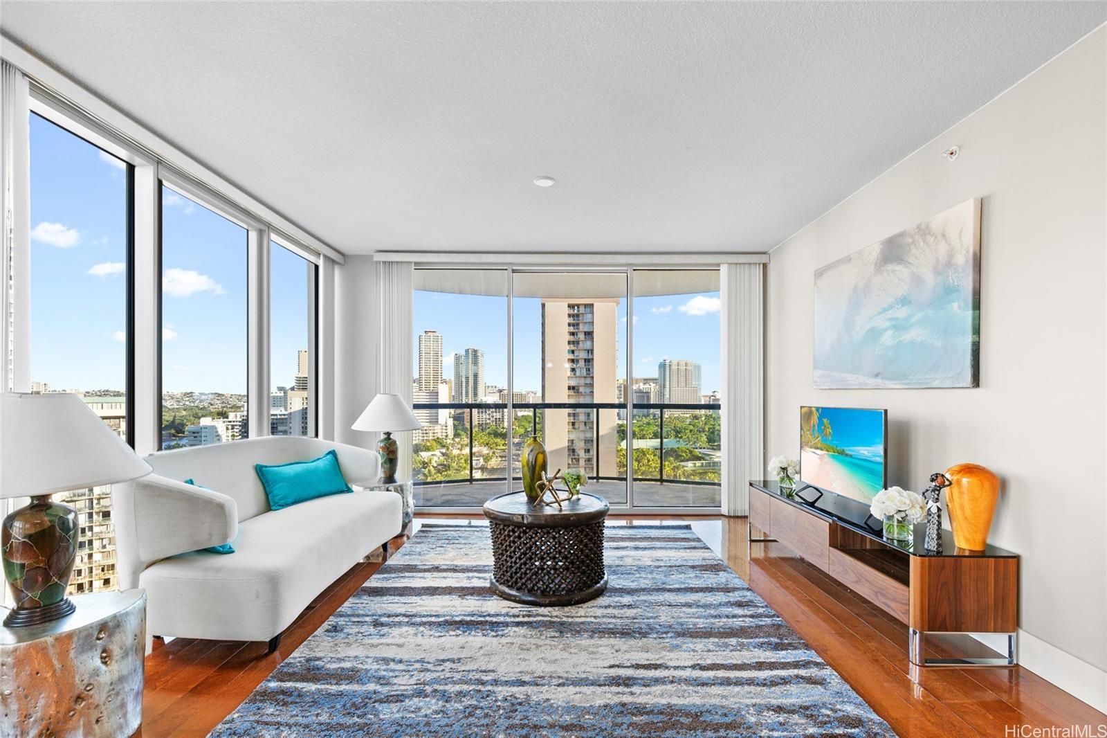 a living room with furniture and a flat screen tv