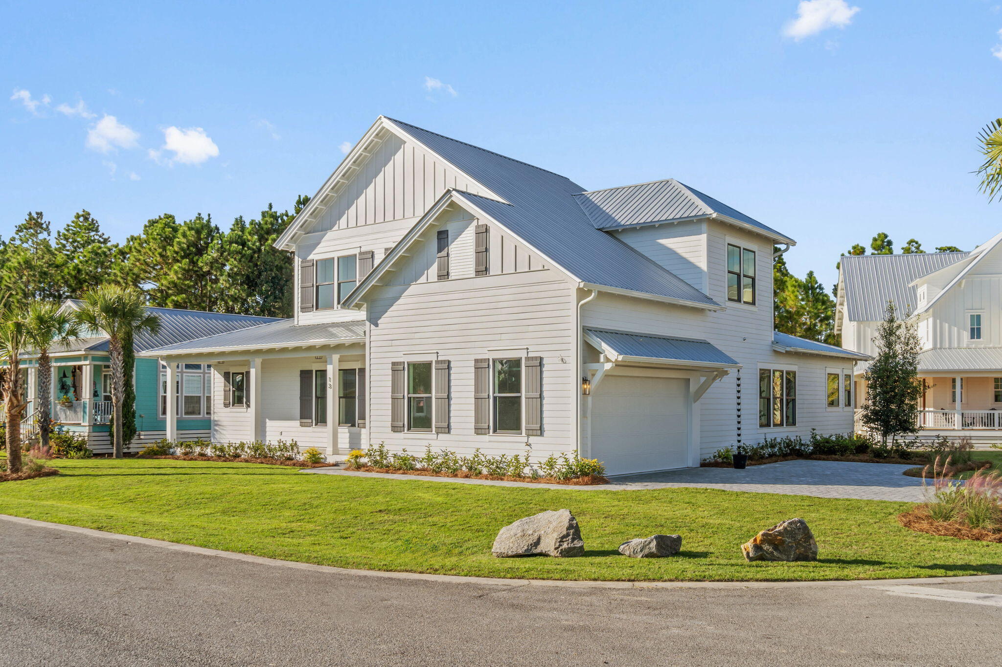 a front view of a house with a garden and porch